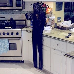 Men’s black bodysuit tag says large.